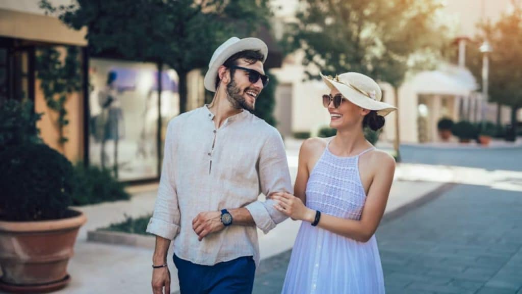 Couple laughing together on a walk