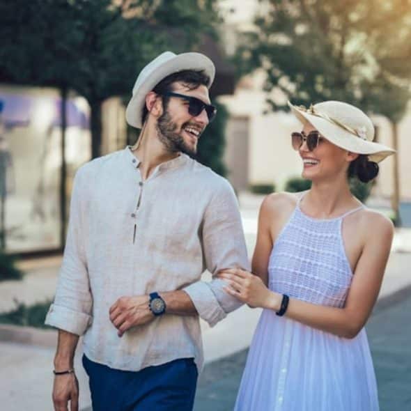 Couple laughing together on a walk