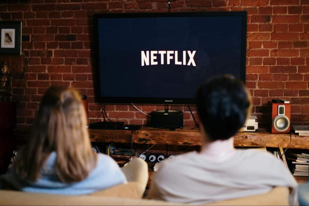 A man and woman watching