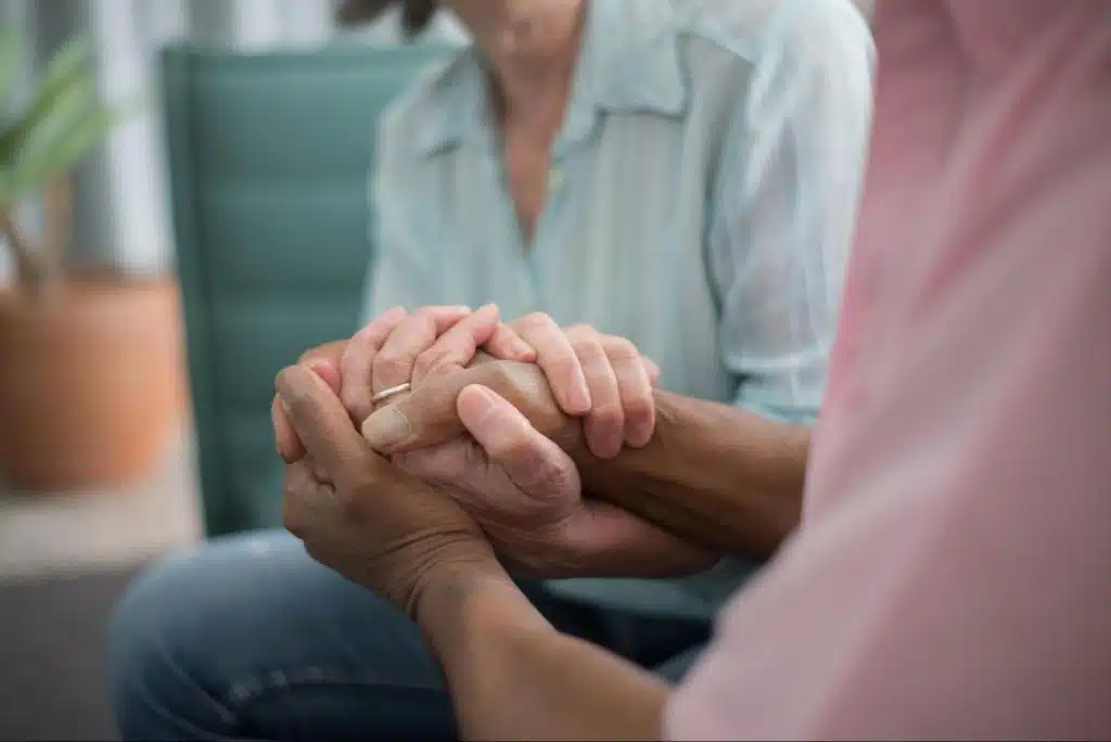 A man and woman holding hands