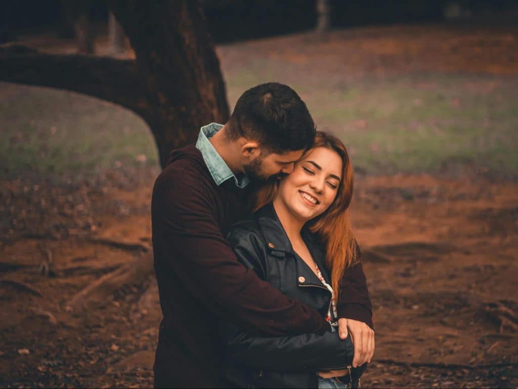 A man kissing a woman’s cheek