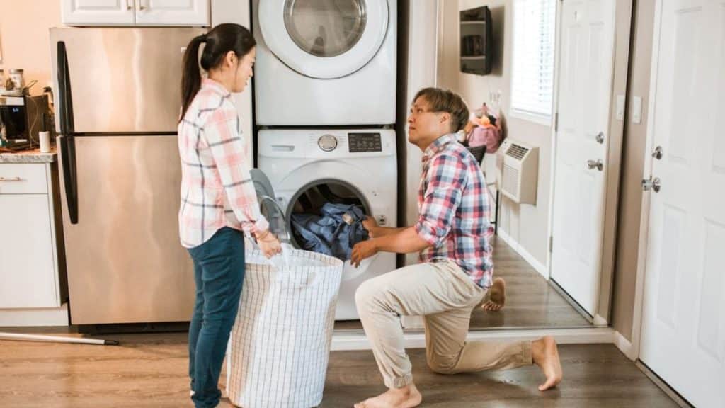 A couple doing the laundry together