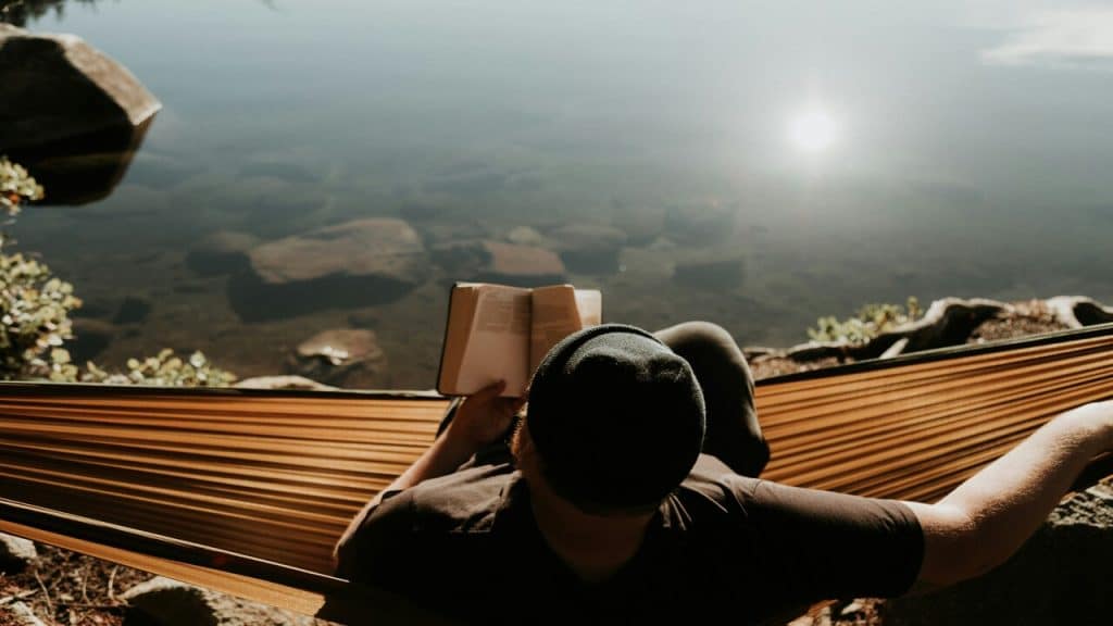 A man relaxing on a hammock