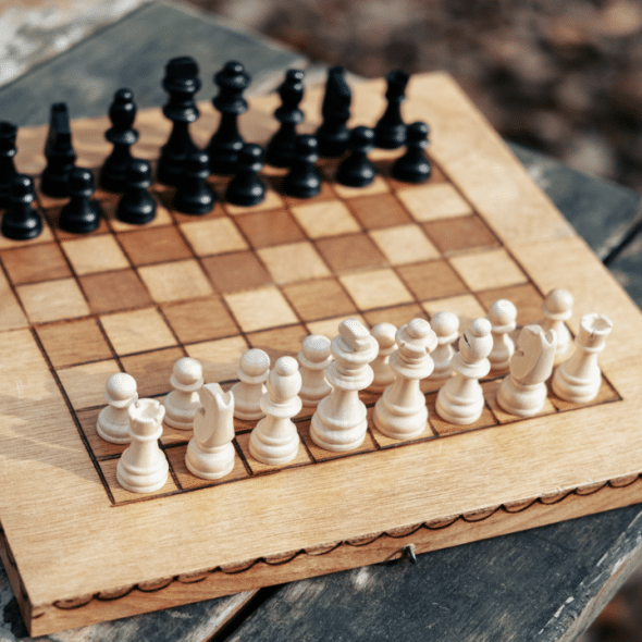 A chess board on a wooden table