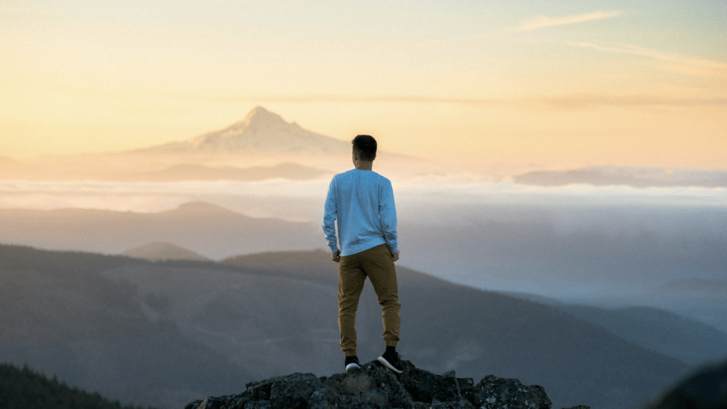 A man standing on top of a mountain
