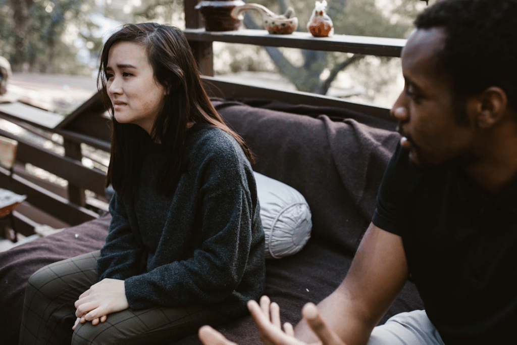 Man Sitting Beside the Crying Woman