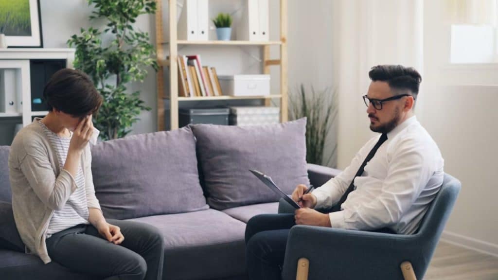 Couple sitting apart after a mild argument