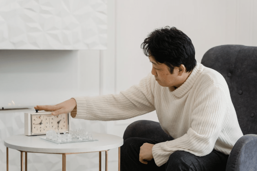 A Man Pressing the Chess Clock