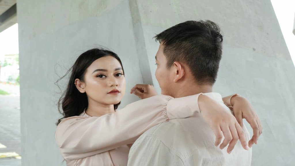 A man and a woman standing next to each other.