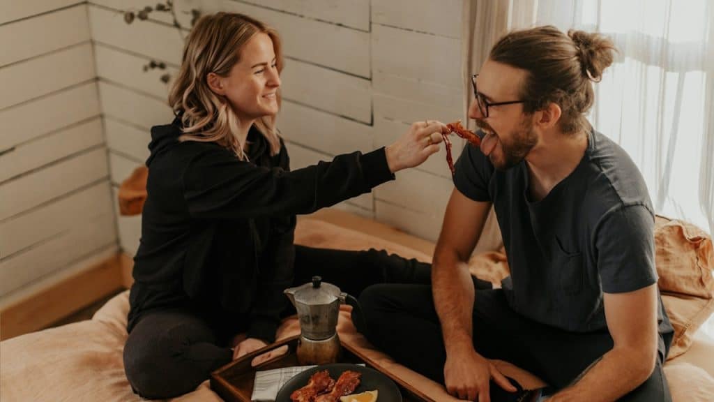 A woman feeding her man