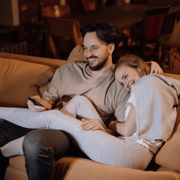 Man and Woman Sitting on the Couch