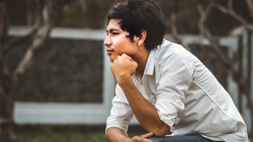 A man sitting in deep thought.