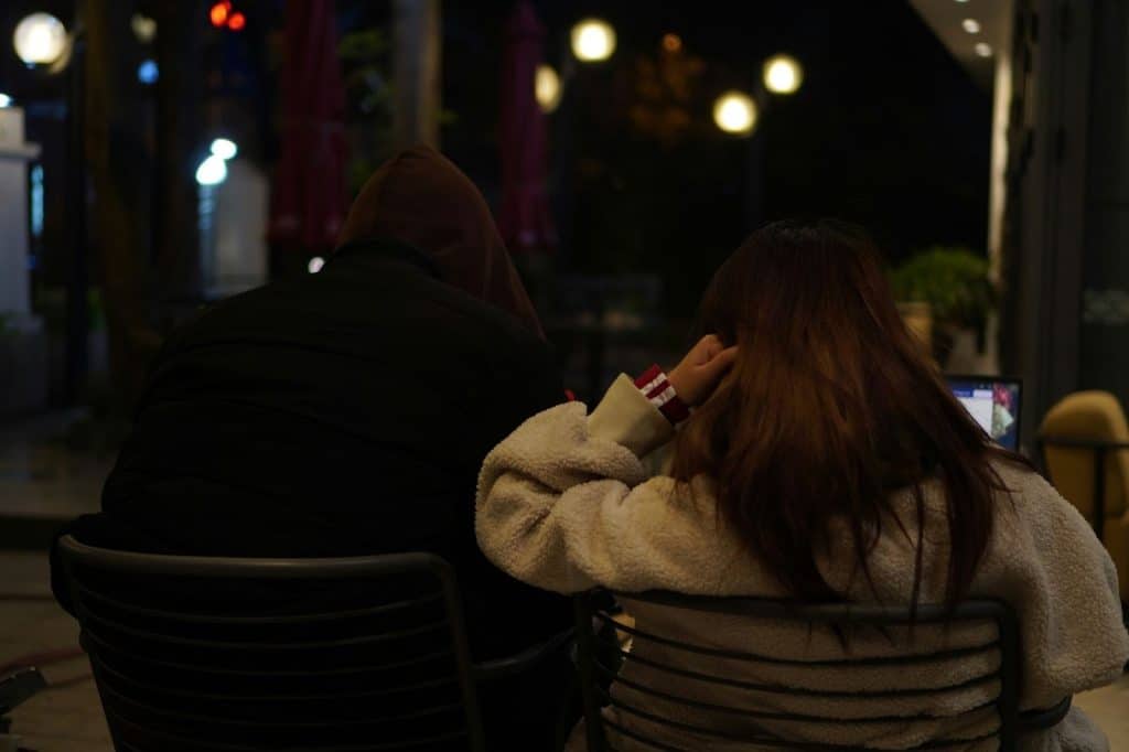 A man and woman sitting