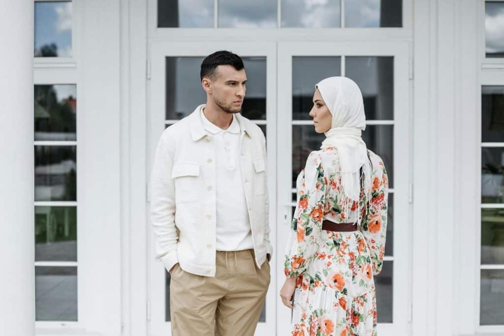 A man and woman facing each other