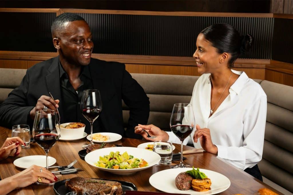 A man and woman smiling