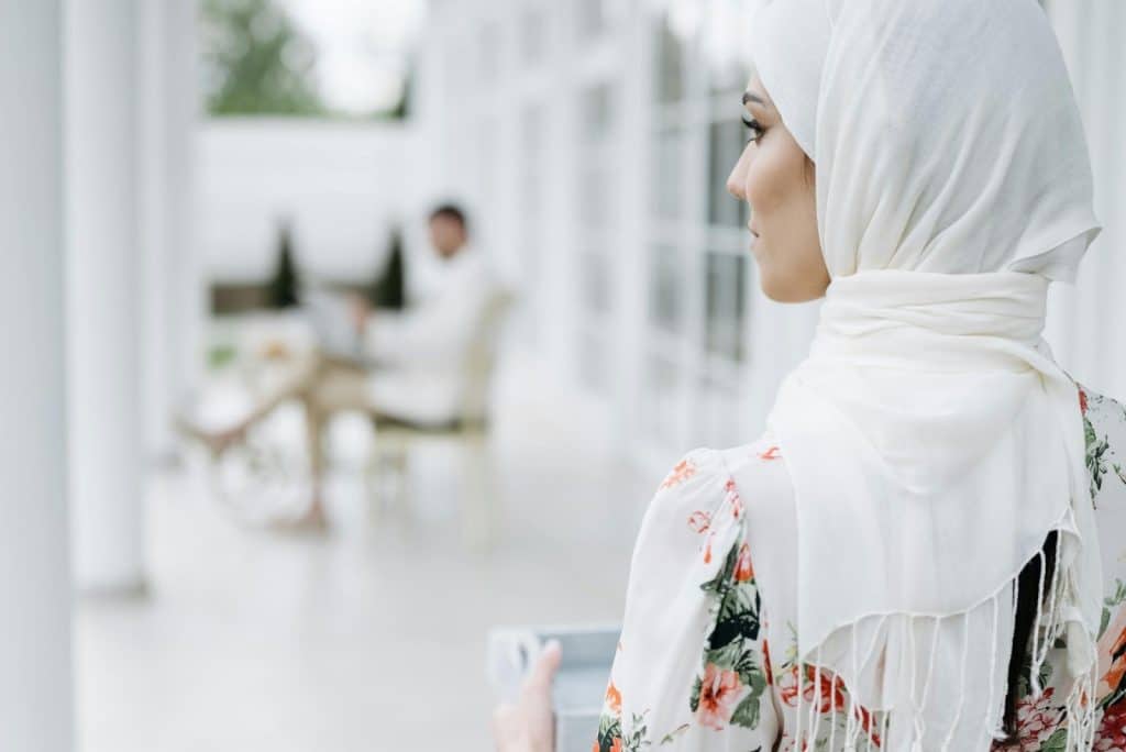 A woman looking at the man