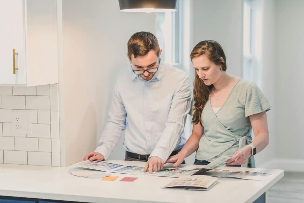 A man and woman looking at the document and deciding