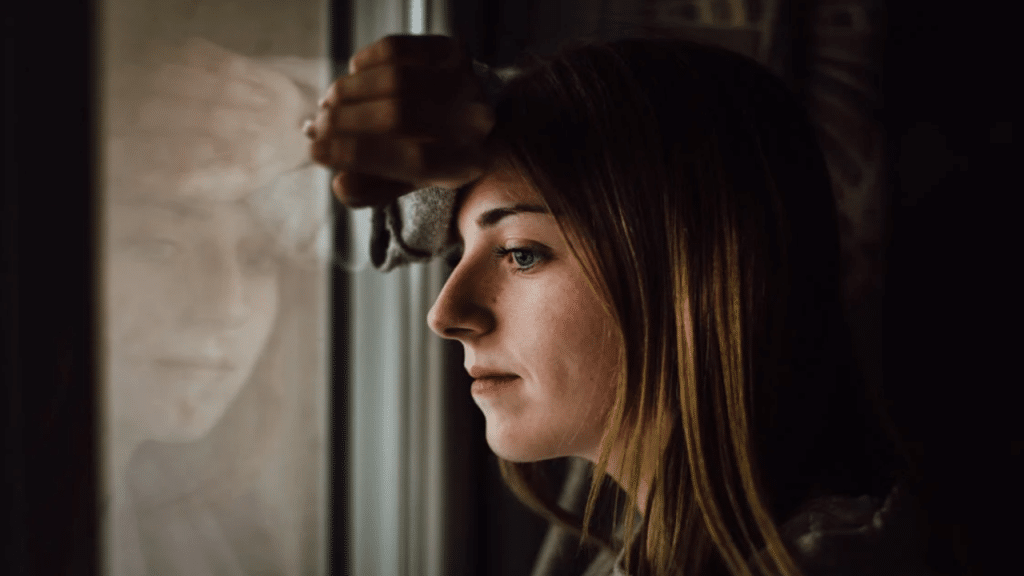 A woman looking out the window