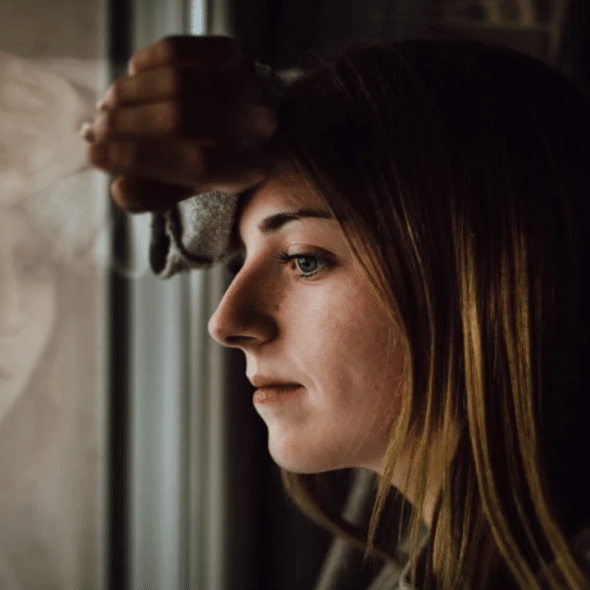 A woman looking out the window