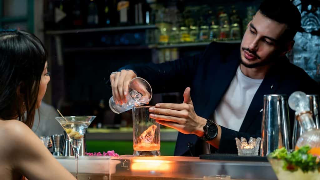 A man and a woman choosing flavors for drinks at a drink shop.