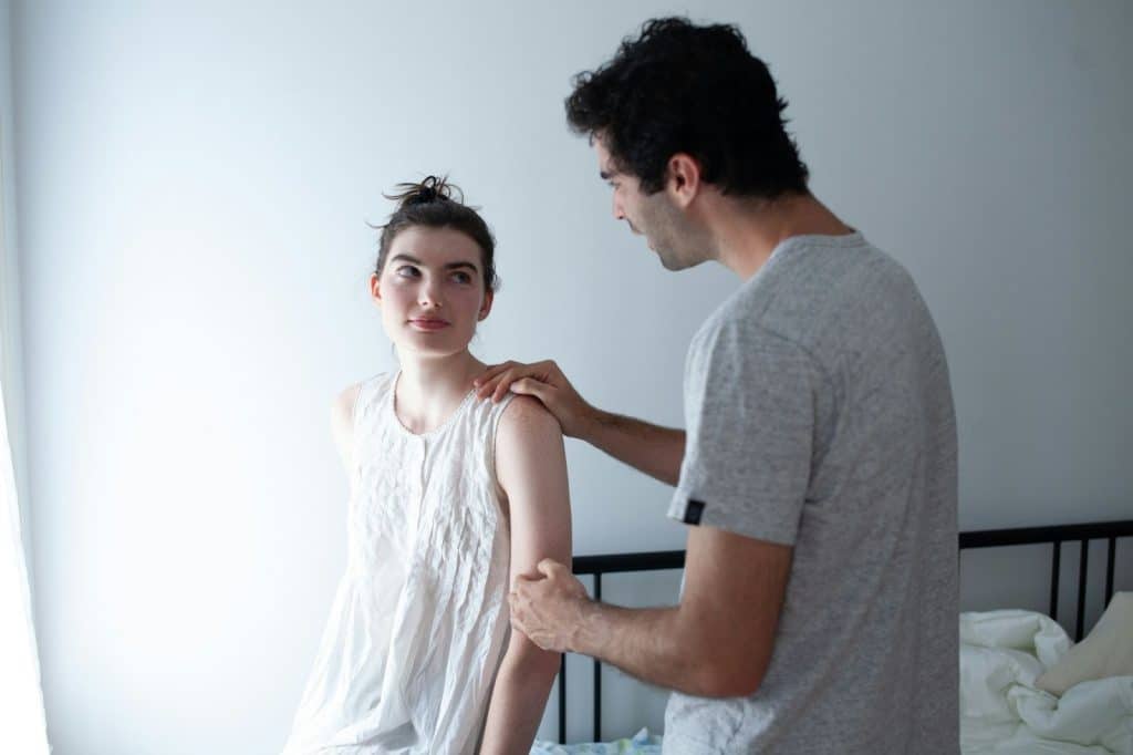 A man holding a woman’s arms