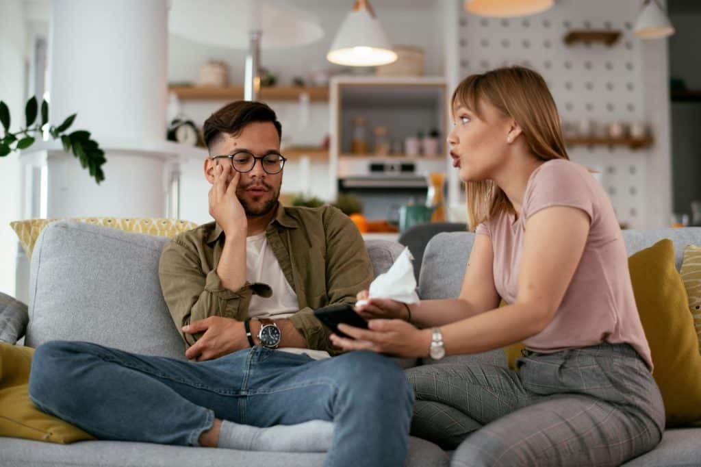 A woman saying something to man