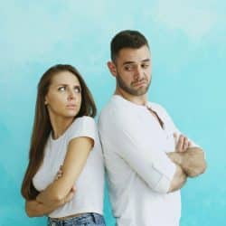 A man and woman turning their back from each other