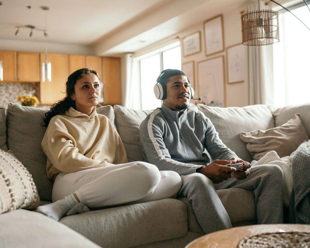 A man and woman just sitting at the couch