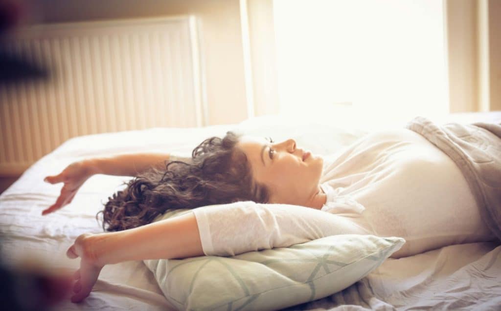 A woman happy waking up