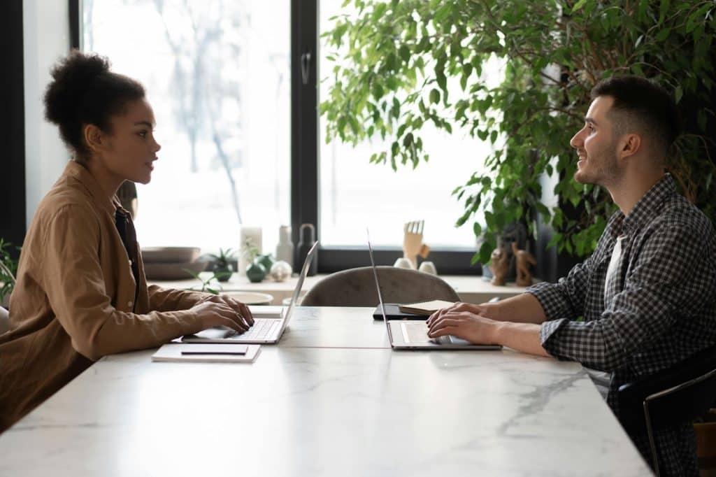 A man and woman facing each other