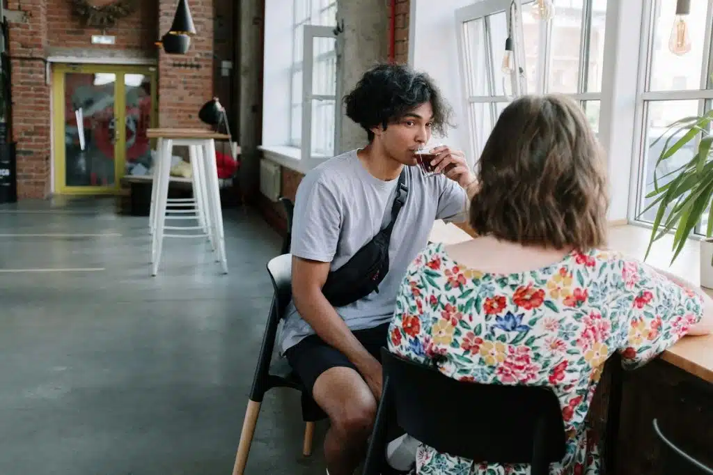 A man and woman having a coffee together