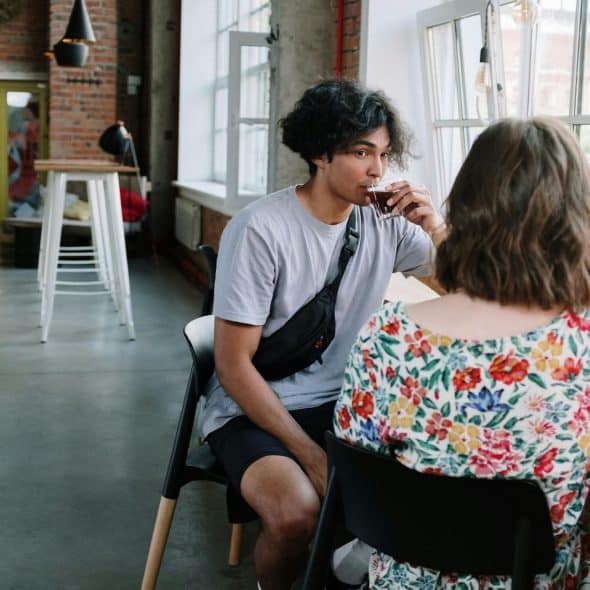 A man and woman having a coffee together