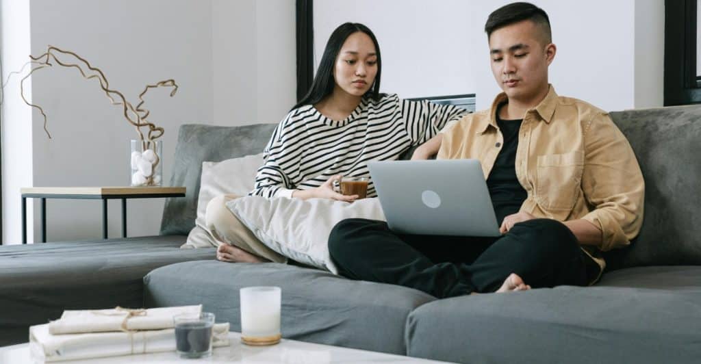 A man and woman at the couch