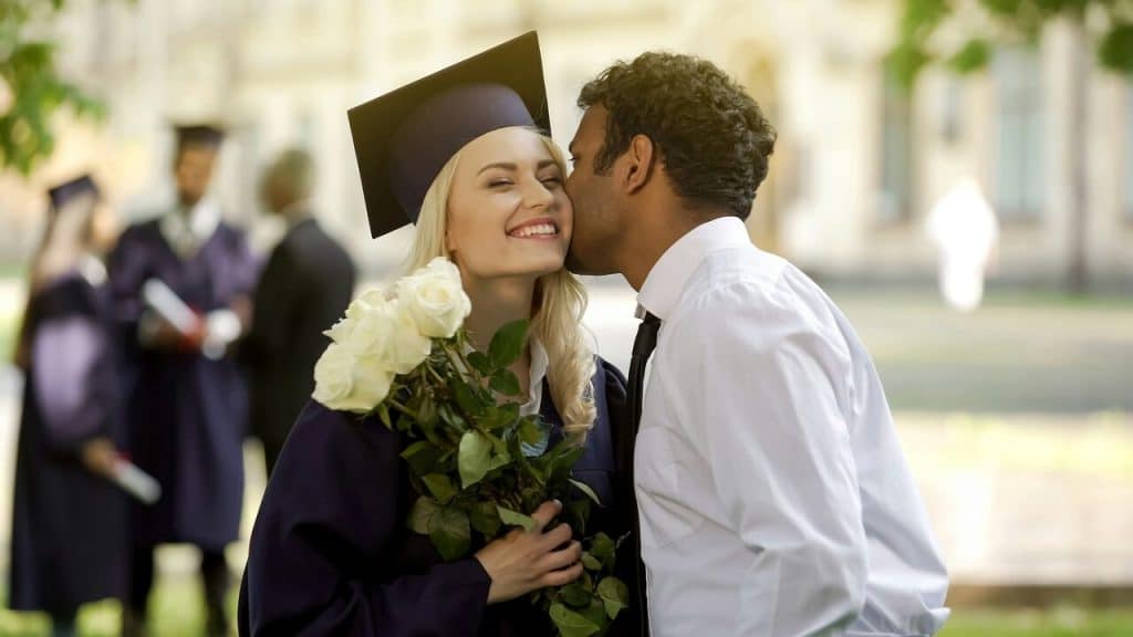 A man congratulating his wife on graduating