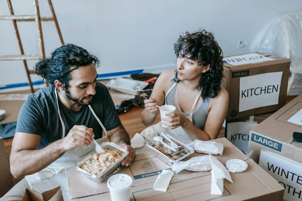 A man and woman having a time to eat and talk