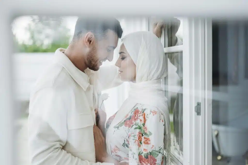A man and woman facing each other