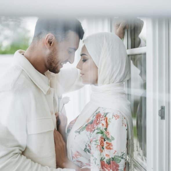 A man and woman facing each other