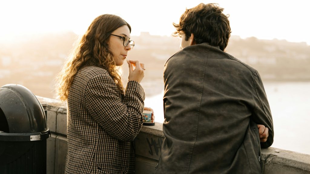 A man and a woman talking to each other.