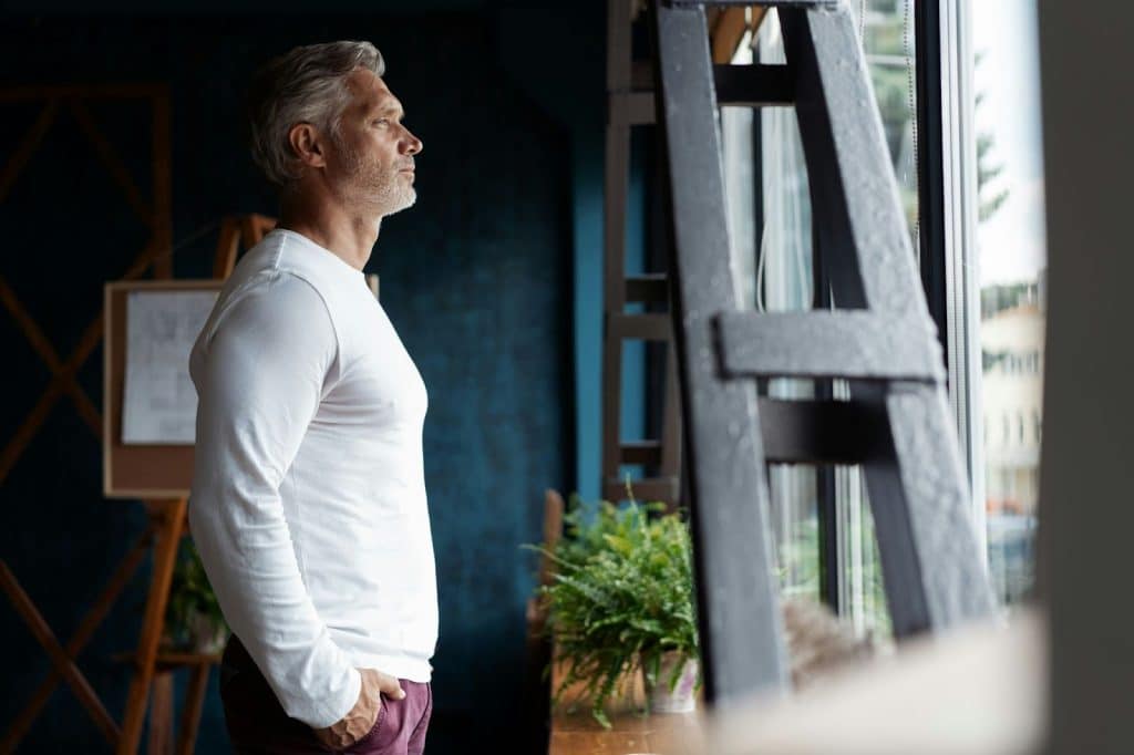A man looking outside the window