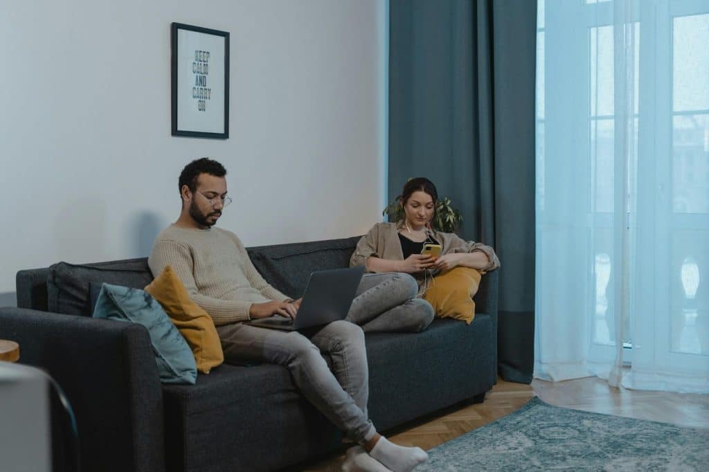 A man and woman doing their own businesses 