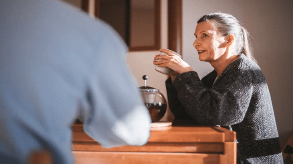 A couple talking over coffee