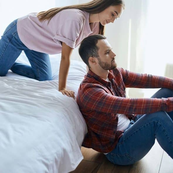 A man avoiding question of a woman