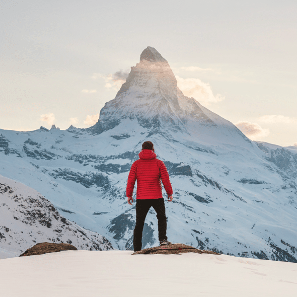 A man on top of a mountain