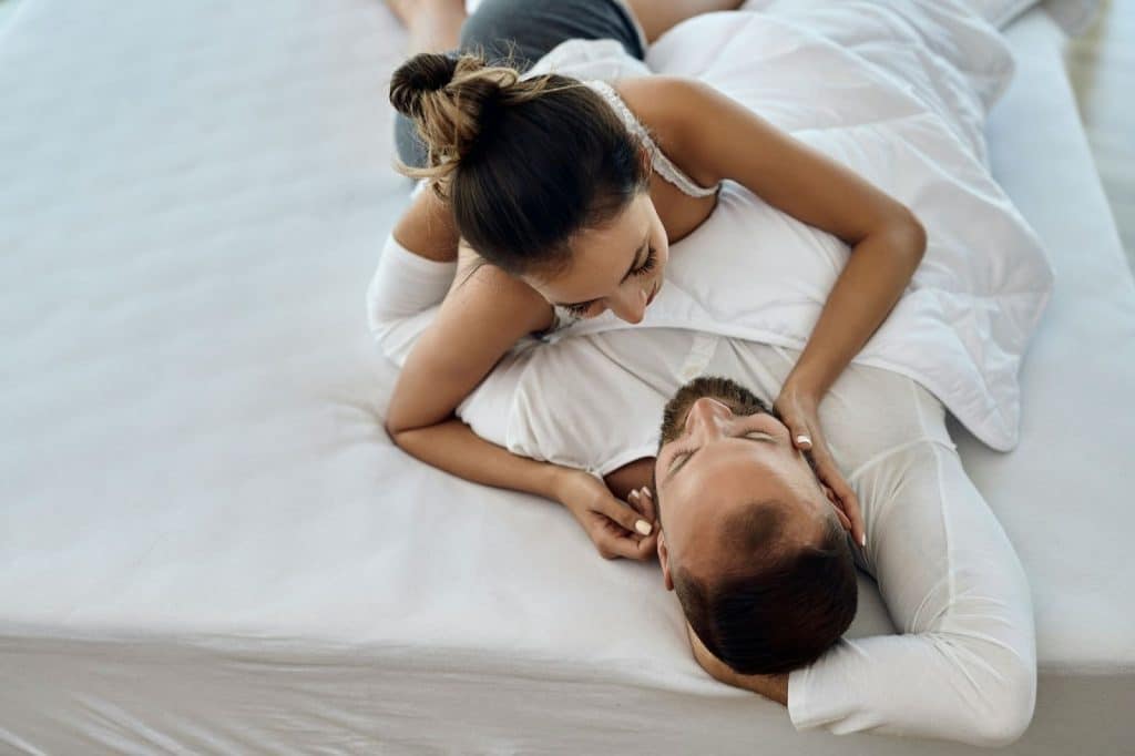 A woman sharing her day to a man