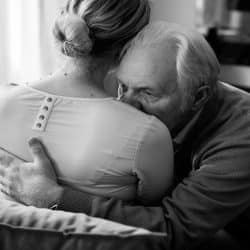 A man consoling his upset wife