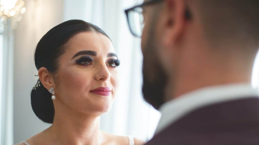 A bride looks at the groom during the wedding ceremony.