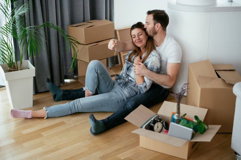A man and woman sitting at the floor