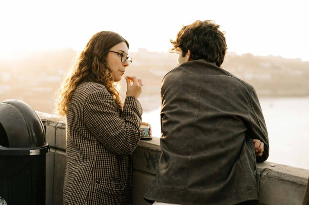 A man and woman standing next to each other