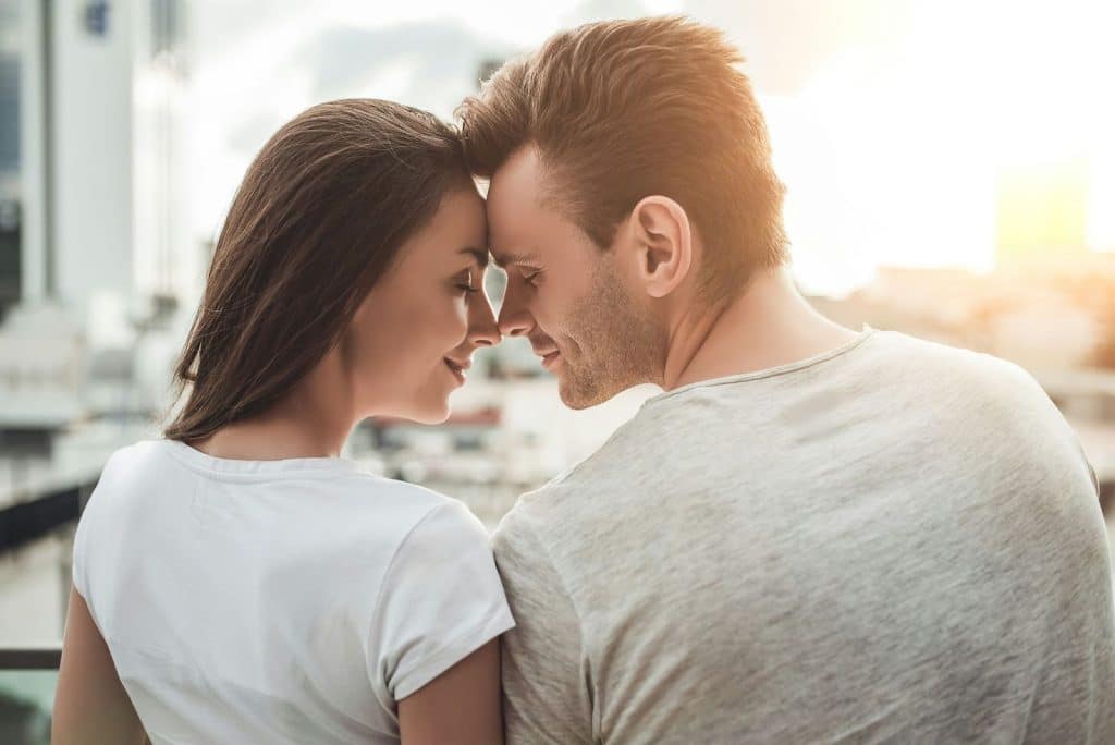 A man and woman facing each other