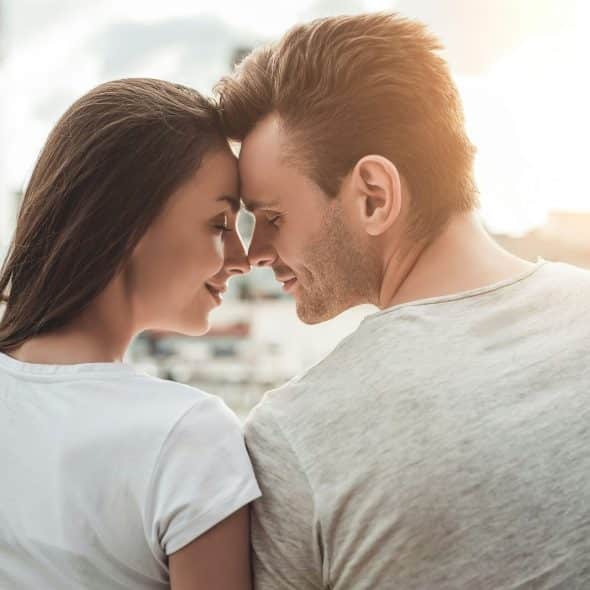 A man and woman facing each other